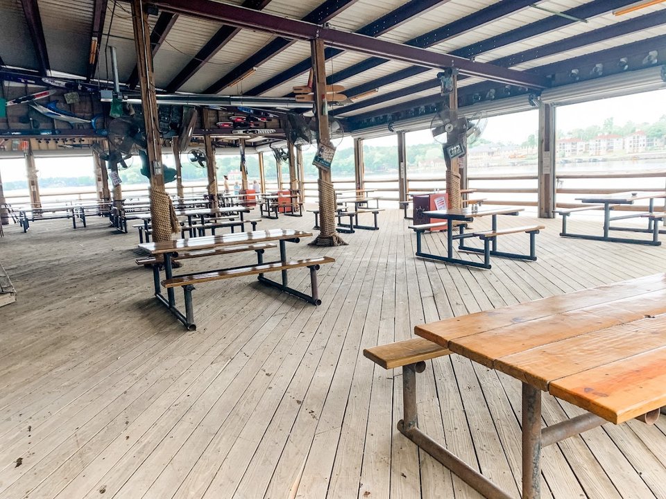 Lakefront seafood restaurant with outdoor seating.
